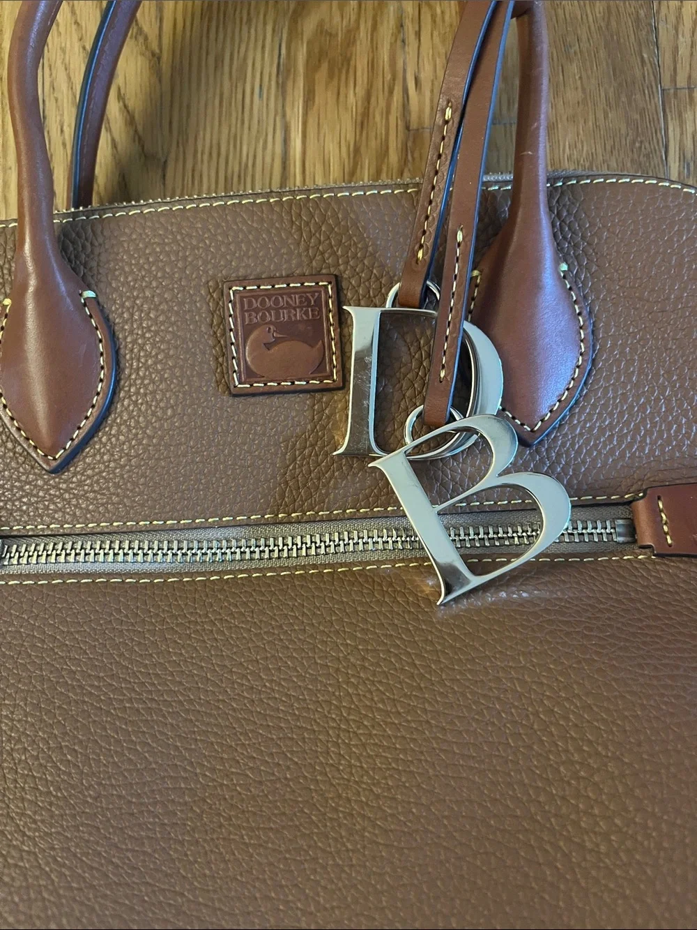 Dooney & Bourke Pebble Leather Satchel in Cognac Brown with Silver Charm